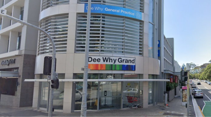 Pittwater Road entrance at the Sturdee Parade corner, showing the 834 Dee Why Grand building.